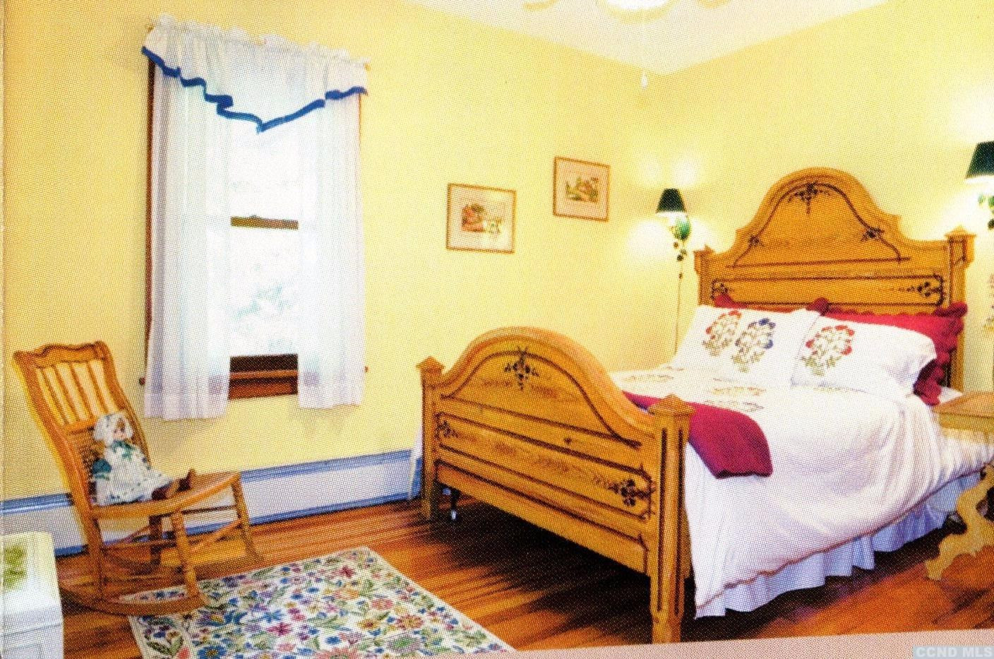 20 Hunt Road Hillsdale, NY 12529 - Photo 10 of 10 a bedroom with a bed and a dresser next to a window