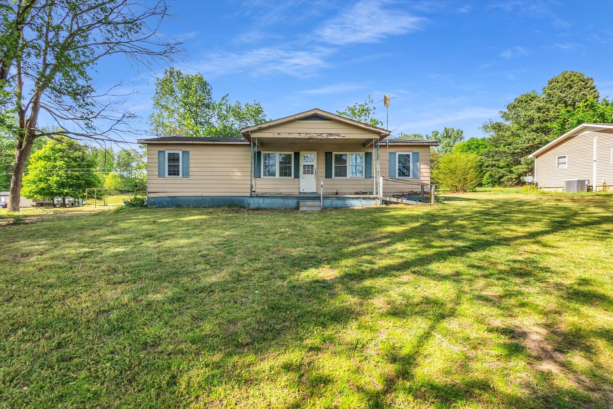 216 Burch Road Dyersburg, TN 38024 - Photo 1 of 25 a front view of a house with a garden
