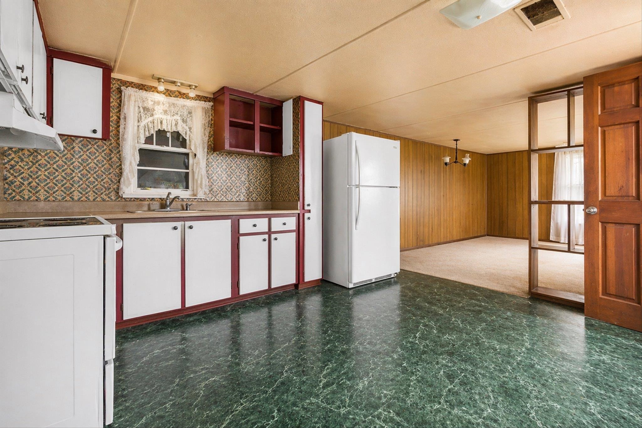 216 Burch Road Dyersburg, TN 38024 - Photo 12 of 25 a view of a kitchen with a fridge and dishwasher