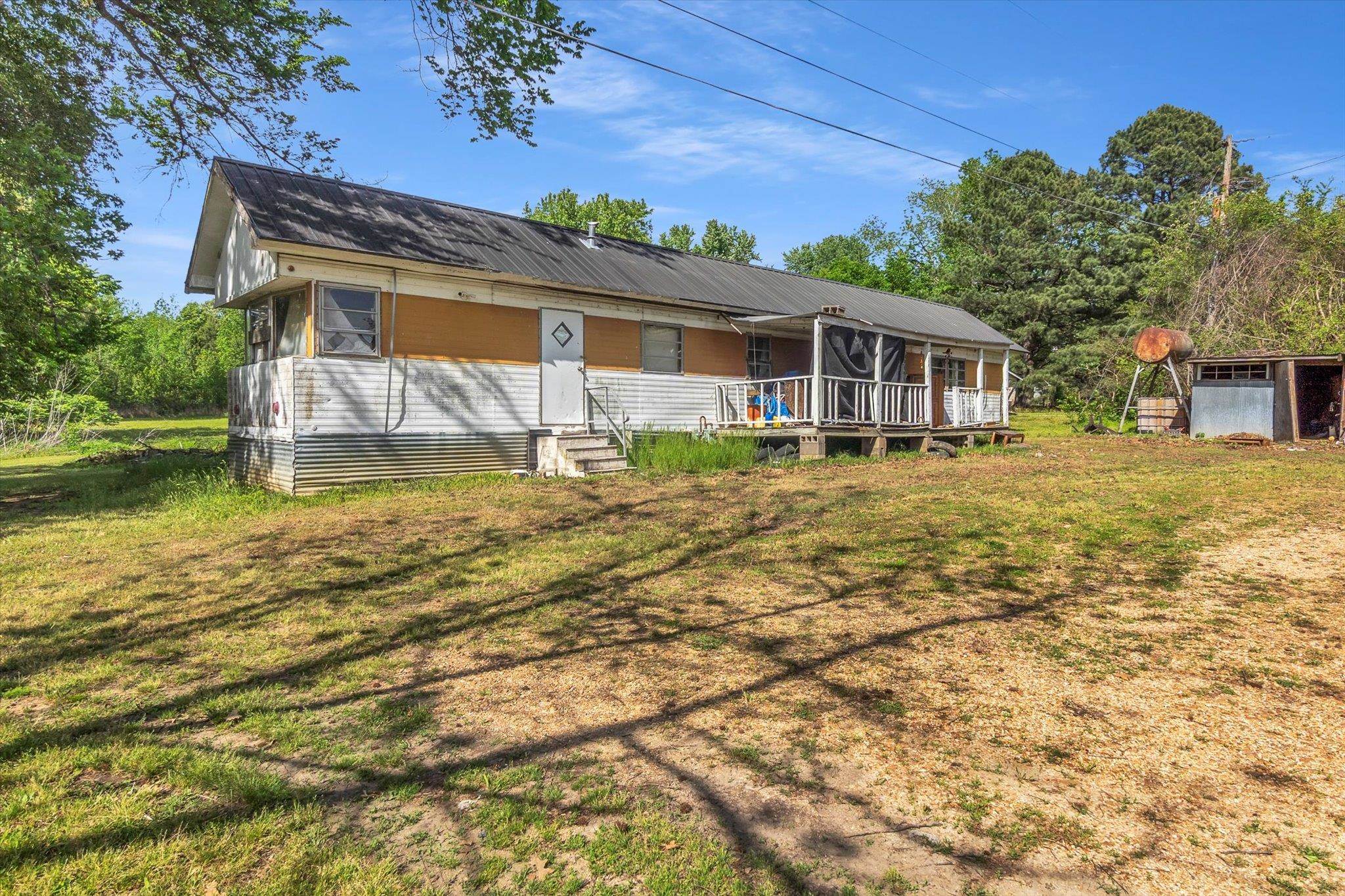 216 Burch Road Dyersburg, TN 38024 - Photo 20 of 25 a backyard of a house with yard barbeque oven and outdoor seating