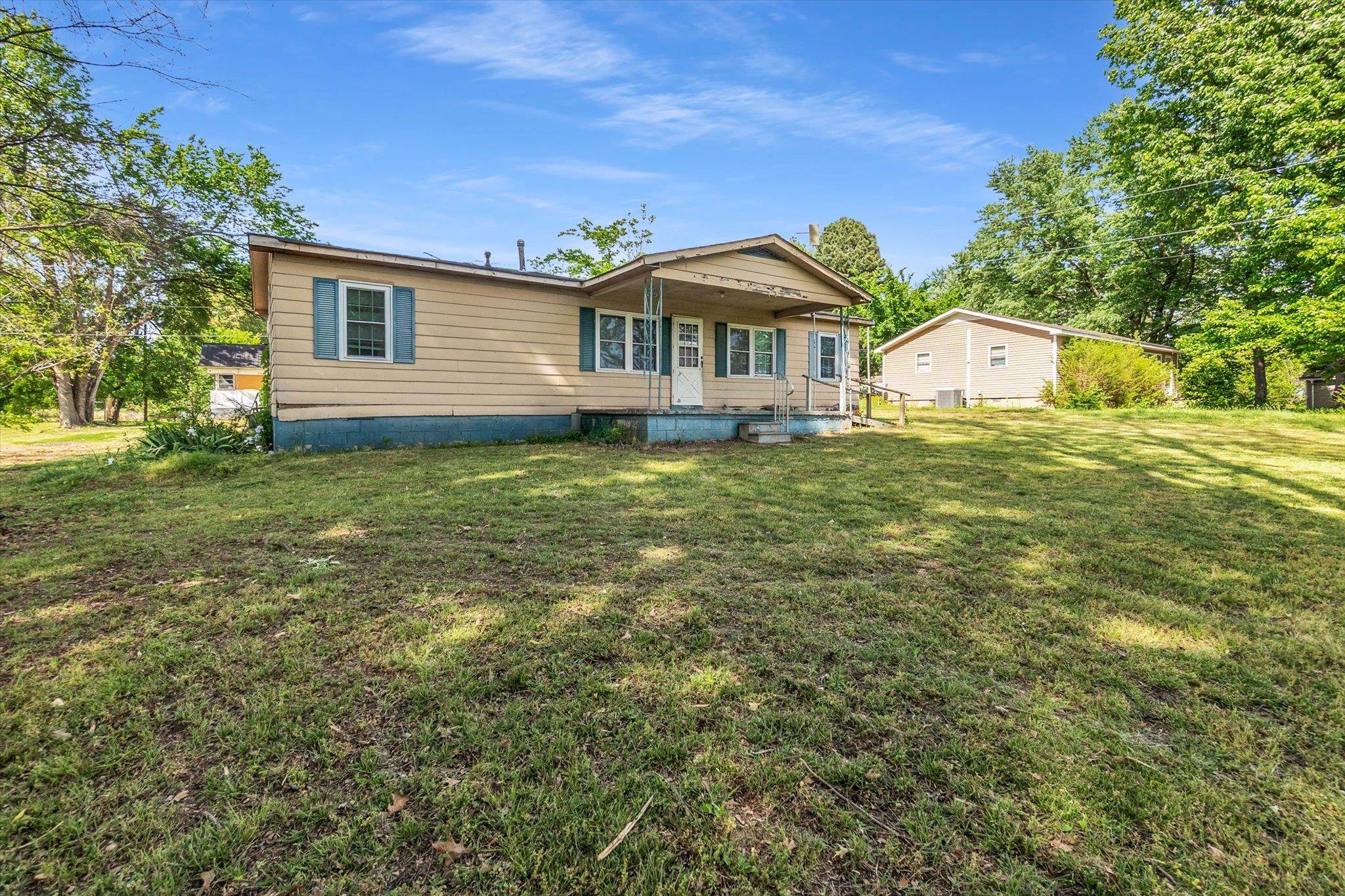 216 Burch Road Dyersburg, TN 38024 - Photo 2 of 25 a front view of a house with a garden