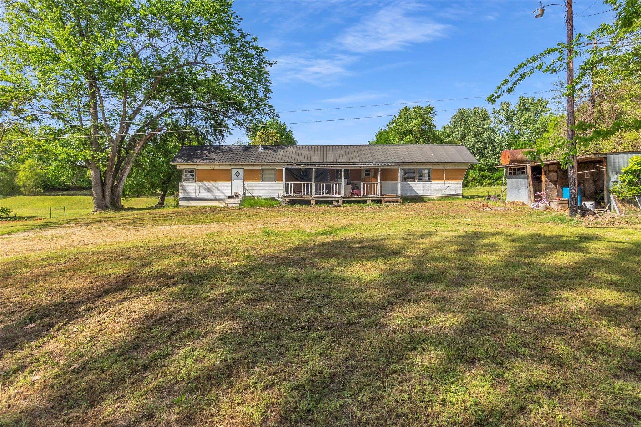 216 Burch Road Dyersburg, TN 38024 - Photo 22 of 25 a view of a house with a big yard