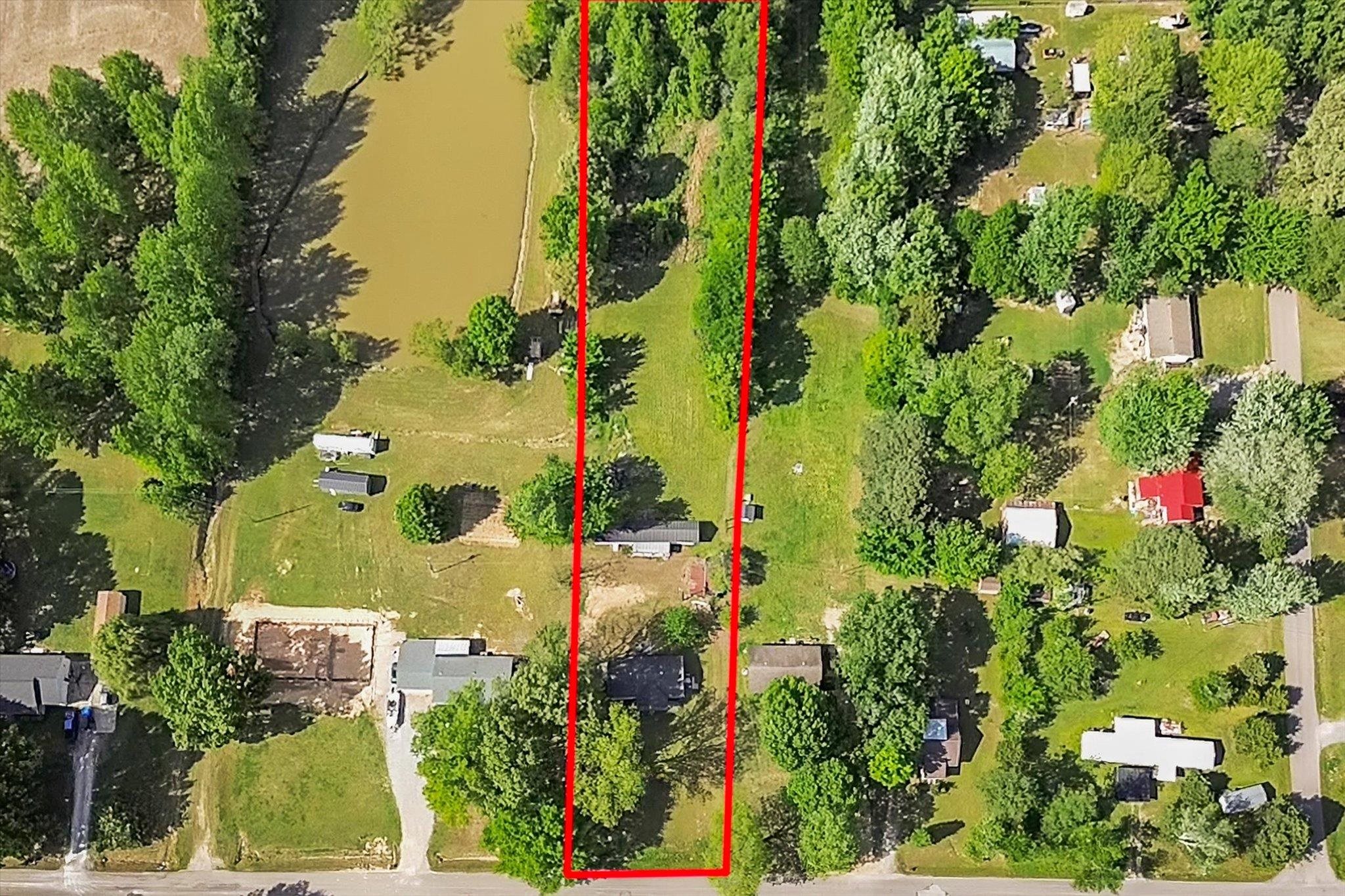 216 Burch Road Dyersburg, TN 38024 - Photo 24 of 25 an aerial view of a house with a yard and lake view