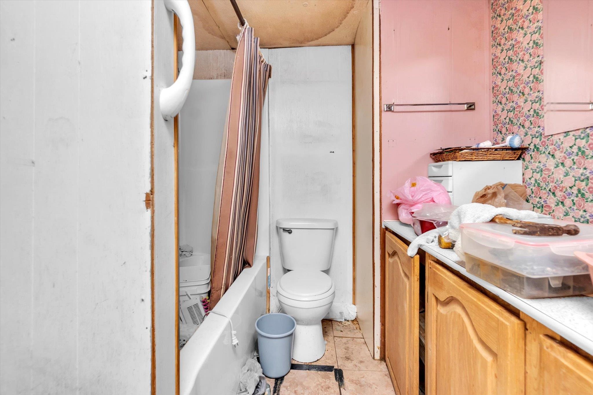 216 Burch Road Dyersburg, TN 38024 - Photo 7 of 25 a bathroom with a sink toilet vanity and shower