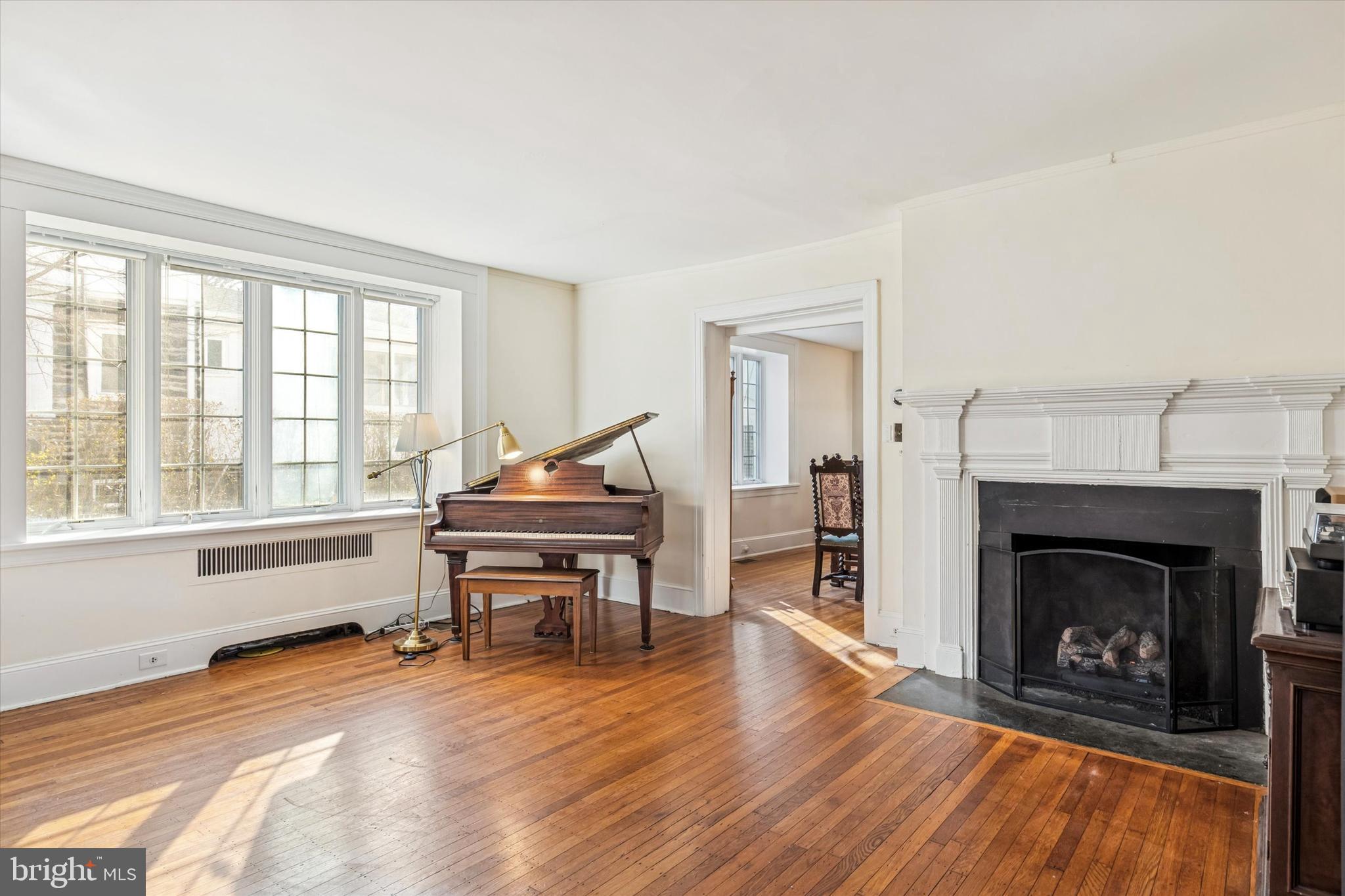 114 Llanfair Road Ardmore, PA 19003 - Photo 24 of 80 a living room with furniture and a fireplace