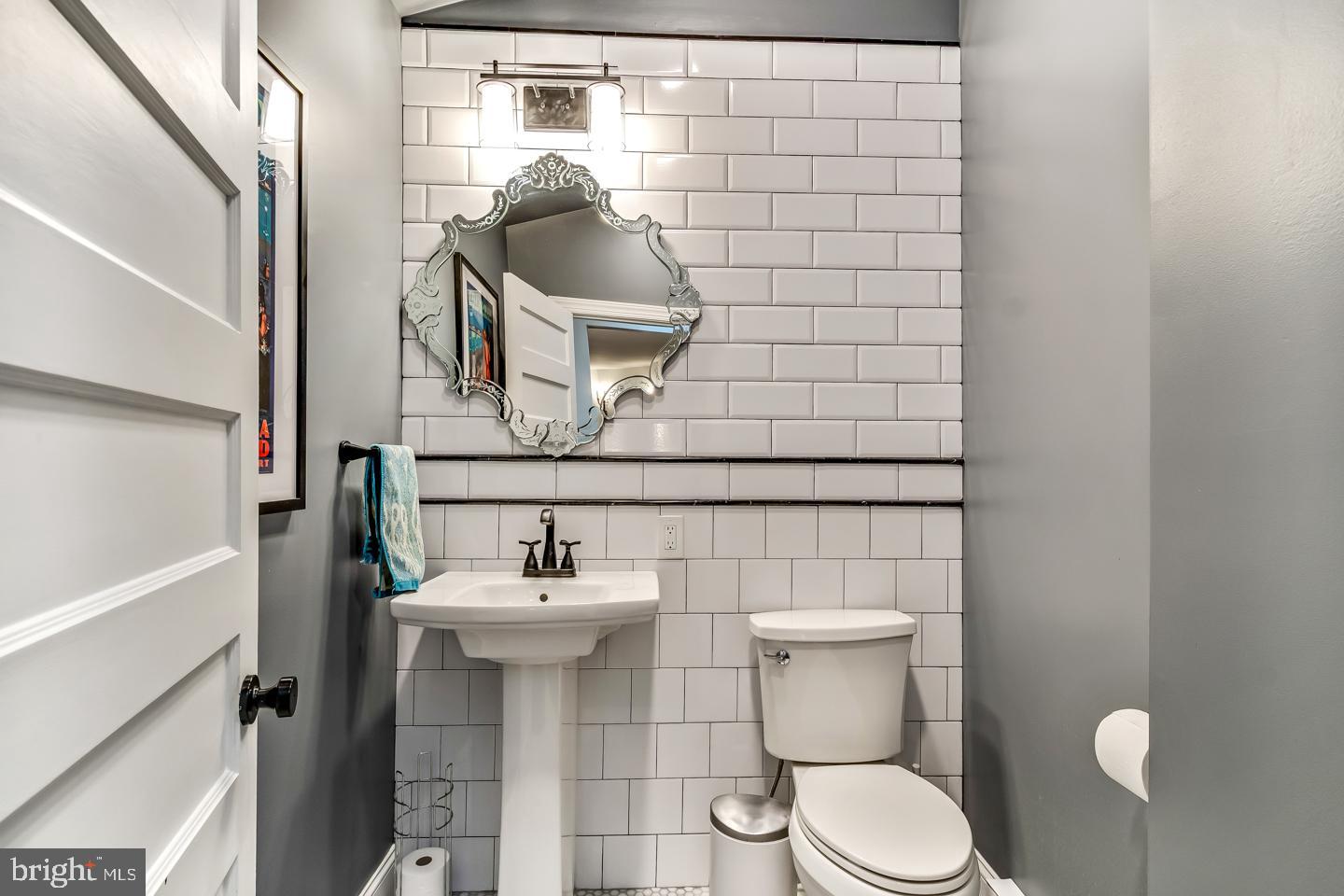114 Llanfair Road Ardmore, PA 19003 - Photo 32 of 80 a bathroom with a toilet and a sink