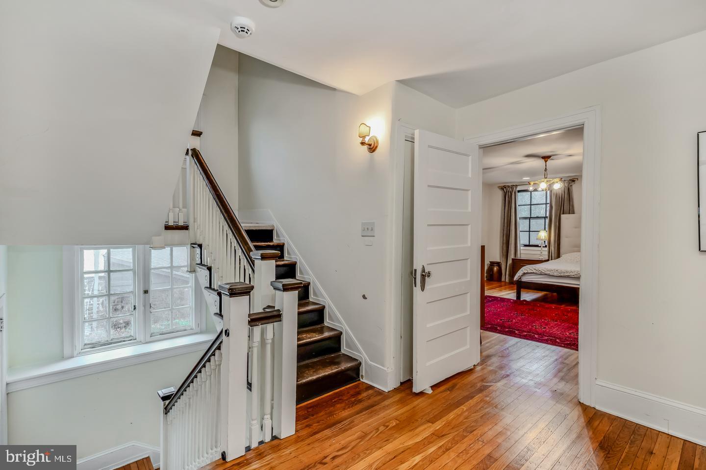 114 Llanfair Road Ardmore, PA 19003 - Photo 34 of 80 a view of a hallway with wooden floor and staircase