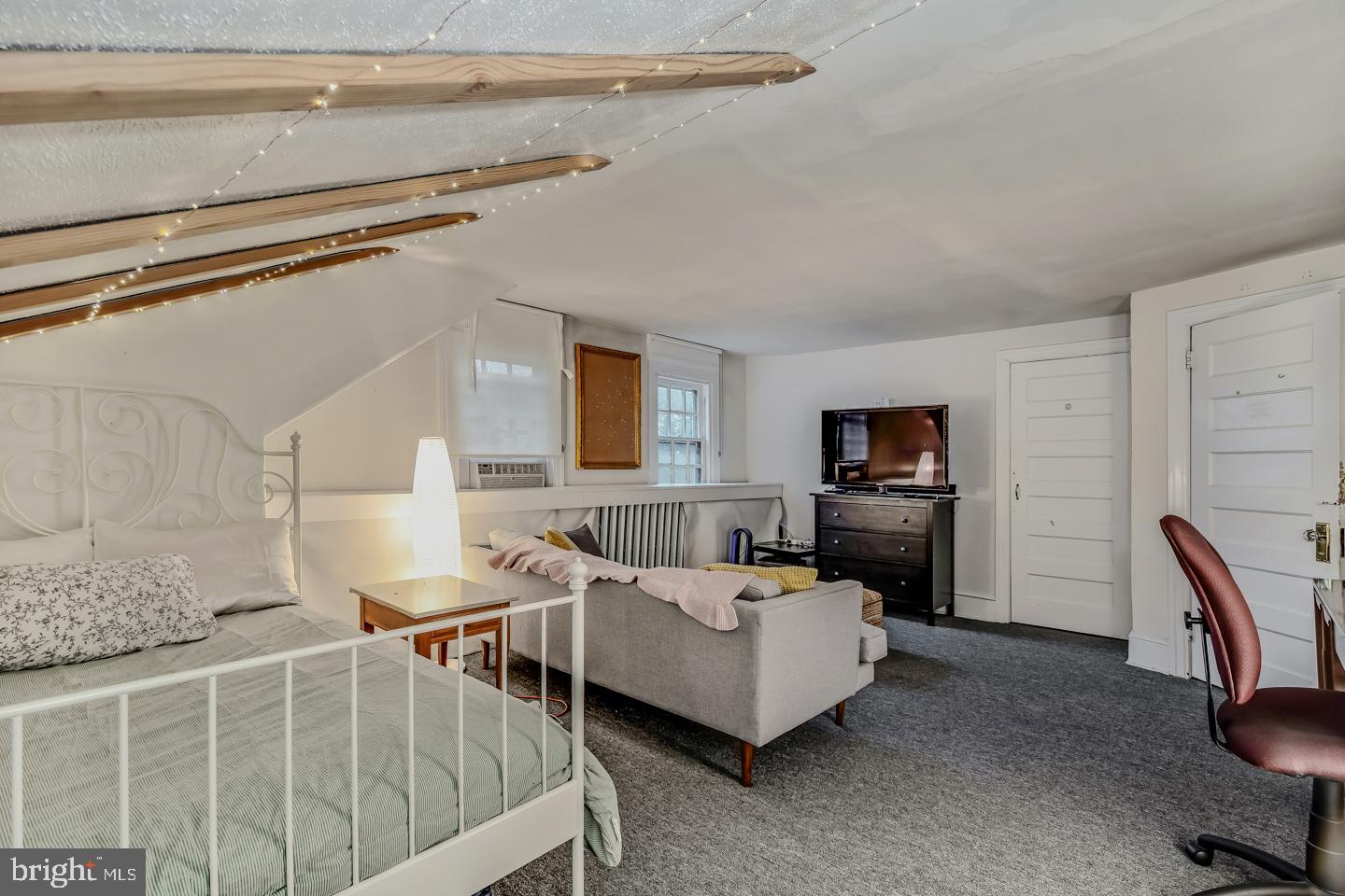 114 Llanfair Road Ardmore, PA 19003 - Photo 48 of 80 a living room with furniture and a flat screen tv