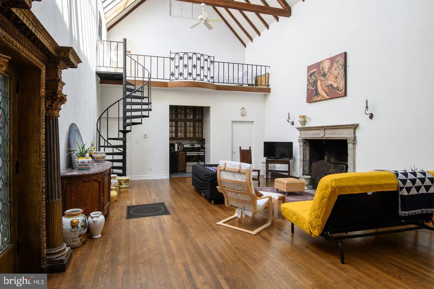 114 Llanfair Road Ardmore, PA 19003 - Photo 55 of 80 a living room with furniture and a fireplace