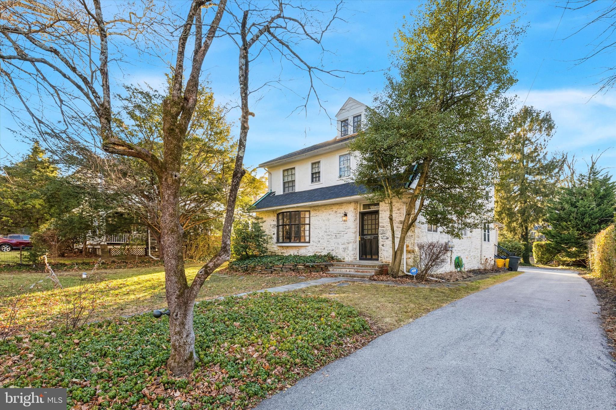 114 Llanfair Road Ardmore, PA 19003 - Photo 6 of 80 a front view of a house with a yard and large trees