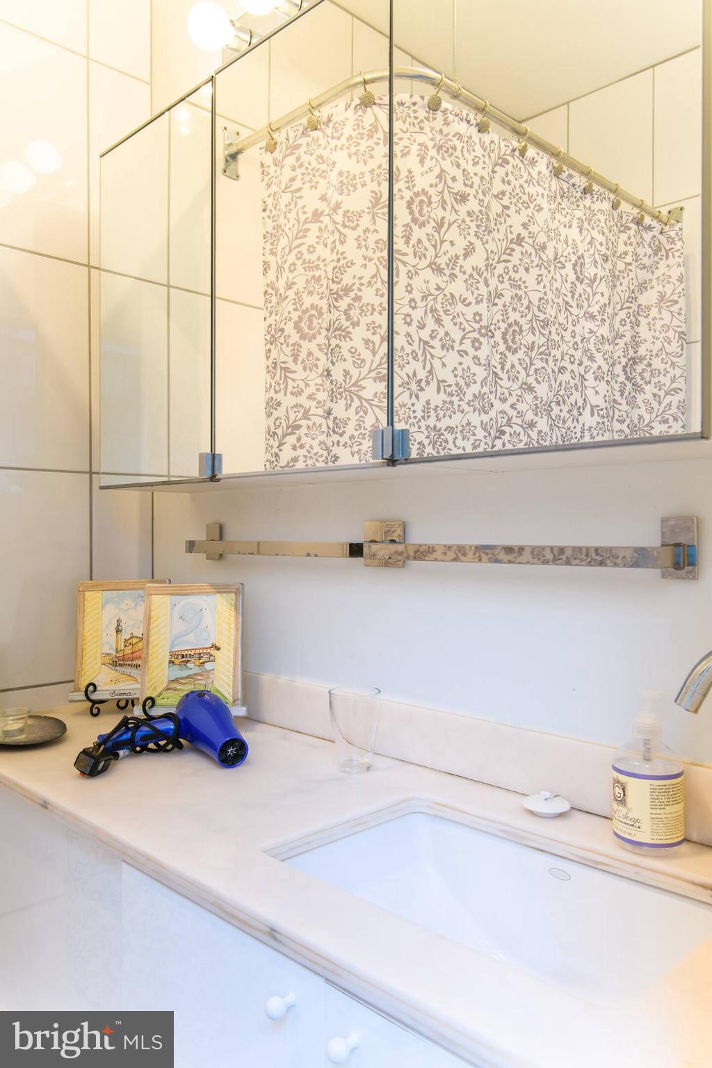 114 Llanfair Road Ardmore, PA 19003 - Photo 67 of 80 a bathroom with a sink and a window