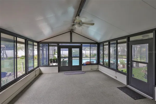 a view of an empty room with windows