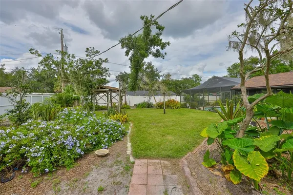 a front view of house with yard and outdoor seating