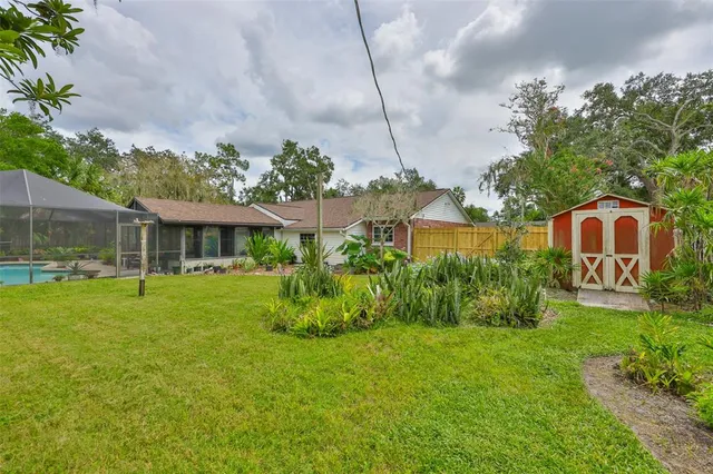 a view of a park with plants and a bench