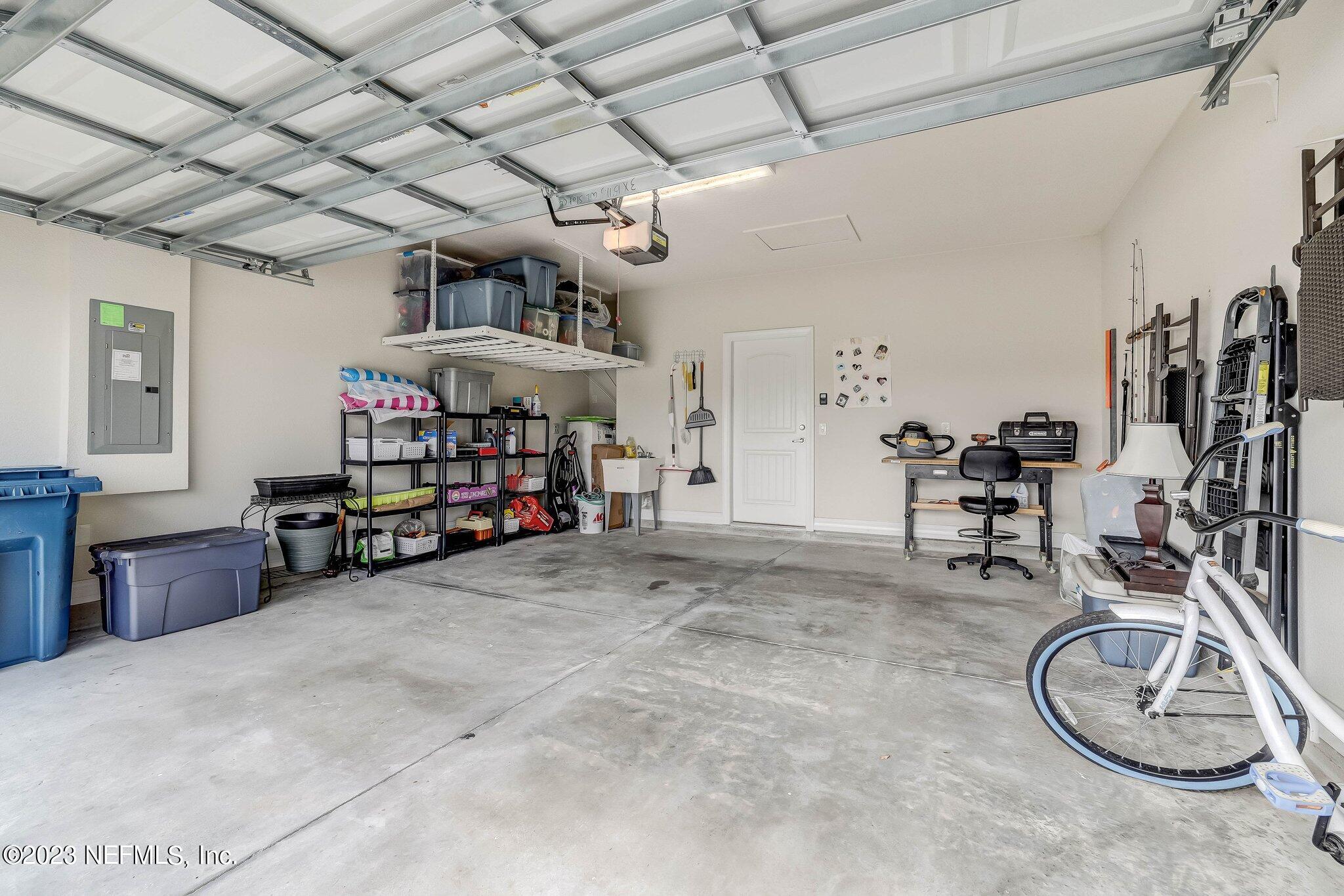 166 Rock Spg Loop St. Augustine, FL 32095 - Photo 23 of 46 Garage w/overhead storage