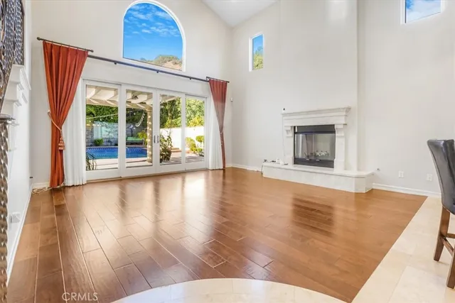 a view of a kitchen with a sink and a refrigerator