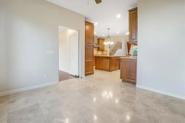 a kitchen with stainless steel appliances granite countertop a stove and a sink with cabinets