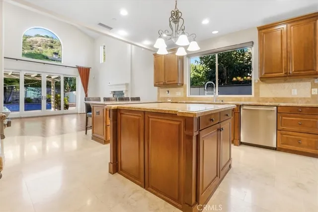 a kitchen with stainless steel appliances granite countertop a stove and cabinets