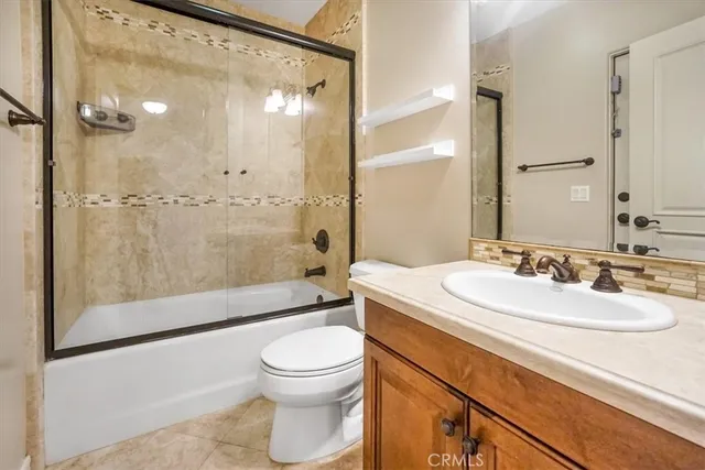 a bathroom with a toilet and a bathtub