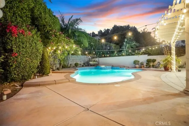 an aerial view of residential house with an outdoor space
