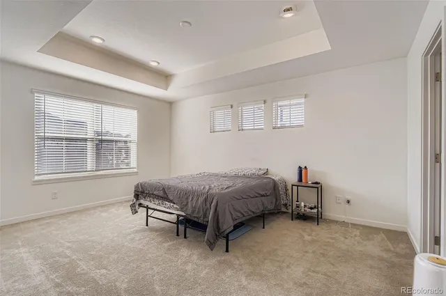 a bed room with a bed and a window