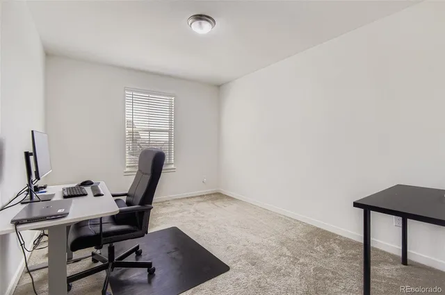 a view of a workspace with furniture