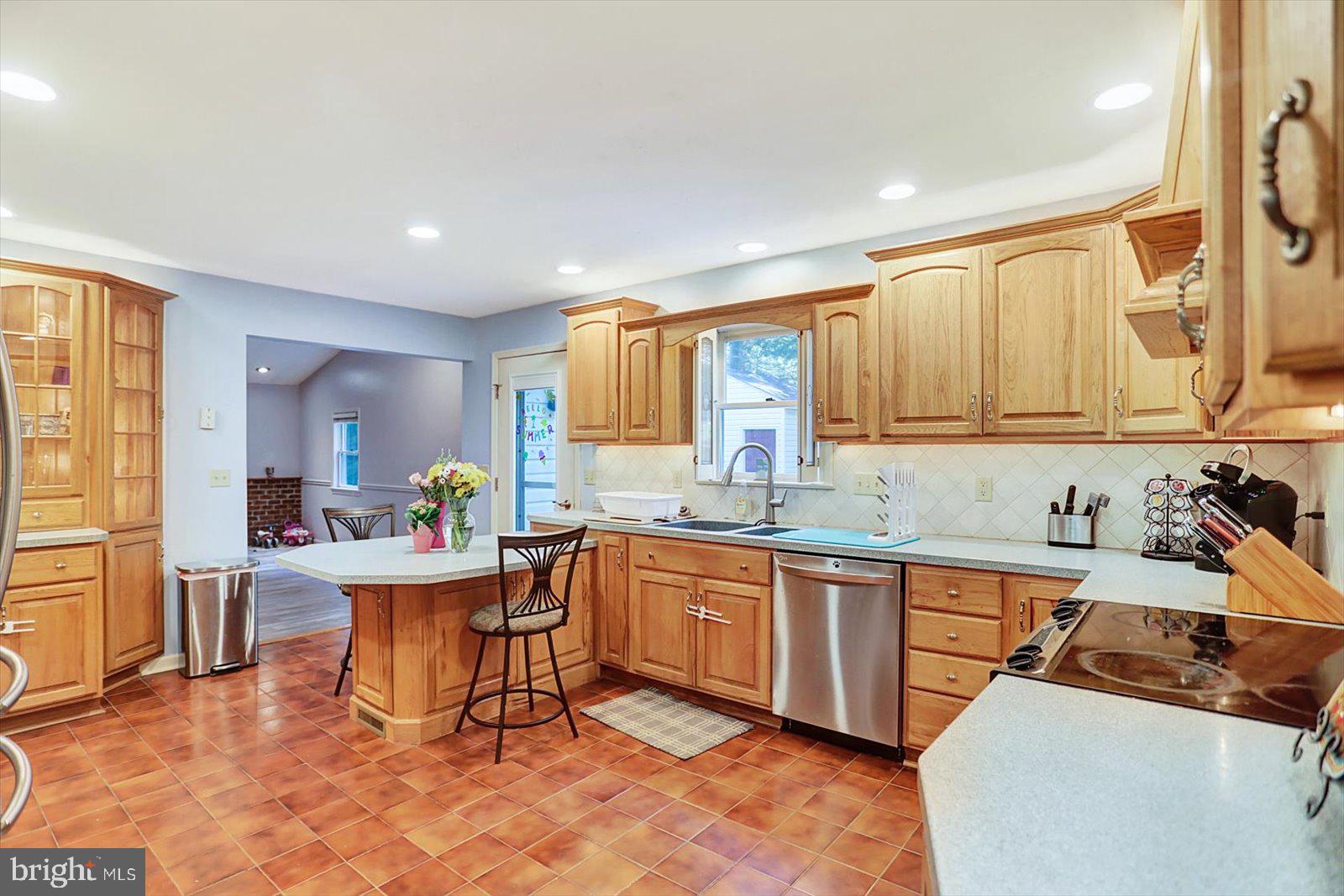 63 Lindsay Lane Hanover, PA 17331 - Photo 14 of 39 a kitchen with a sink dining table and chairs