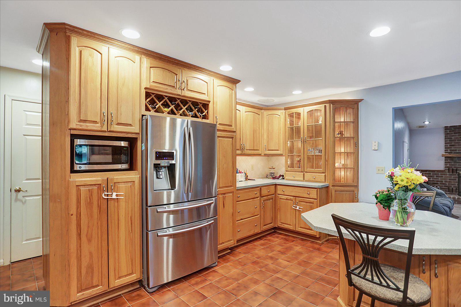 63 Lindsay Lane Hanover, PA 17331 - Photo 16 of 39 a kitchen with stainless steel appliances granite countertop a refrigerator and wooden cabinets