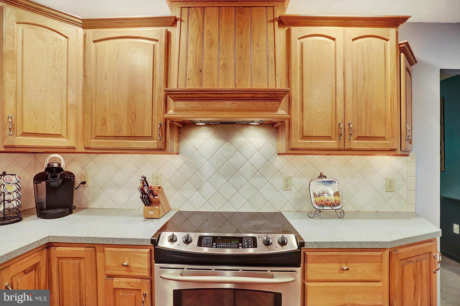 63 Lindsay Lane Hanover, PA 17331 - Photo 17 of 39 a kitchen with stainless steel appliances granite countertop a stove and a microwave