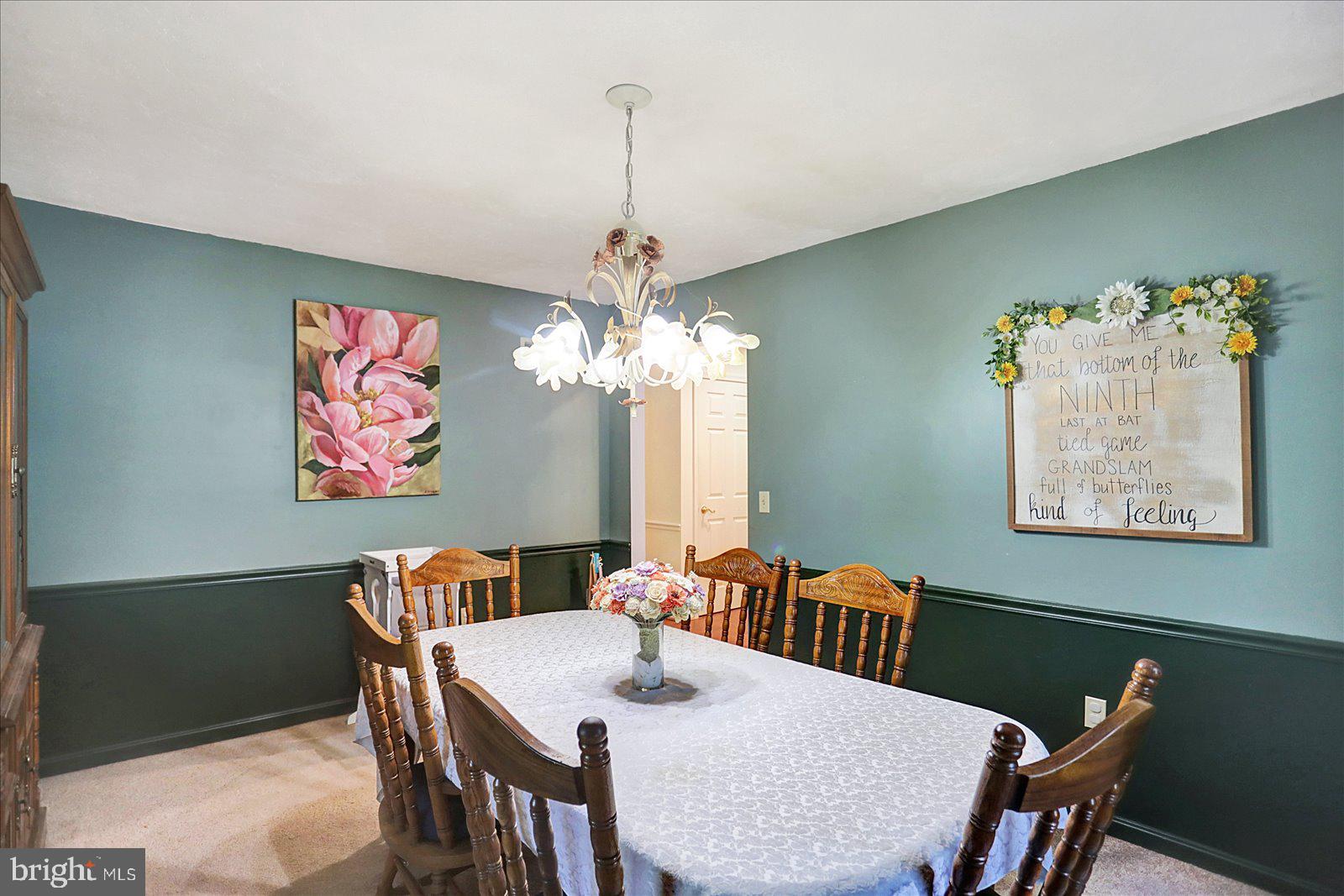 63 Lindsay Lane Hanover, PA 17331 - Photo 22 of 39 a view of a dining room with furniture a chandelier and wooden floor