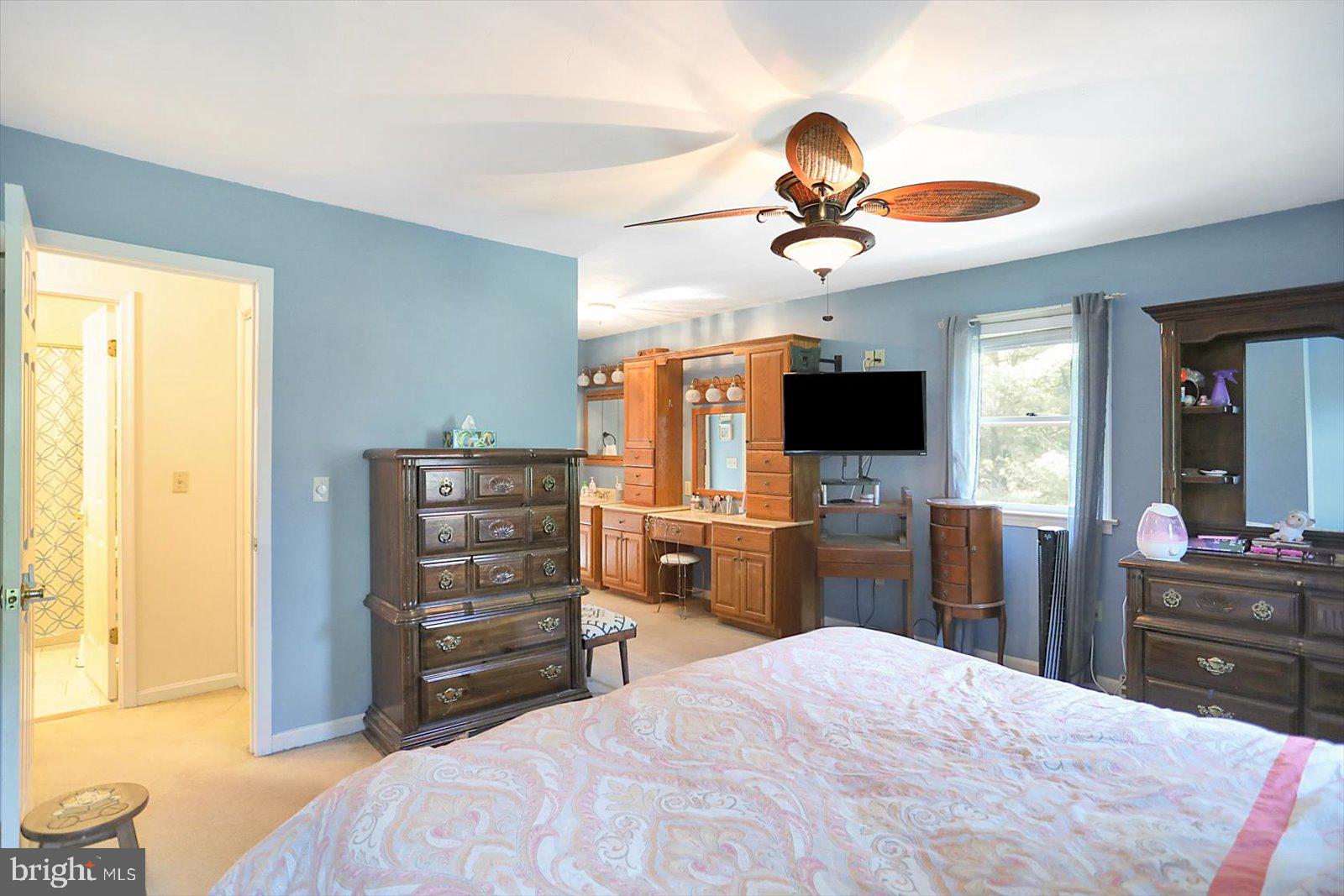 63 Lindsay Lane Hanover, PA 17331 - Photo 25 of 39 a bedroom with a bed and a flat tv screen on dresser