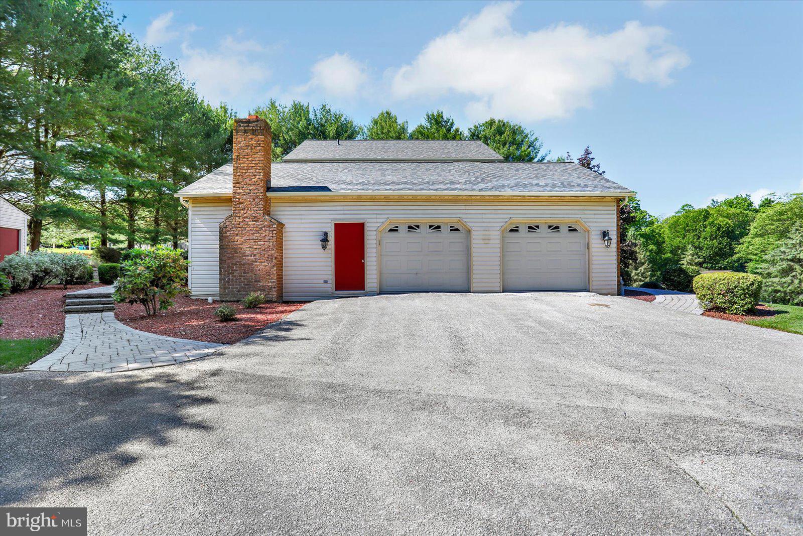 63 Lindsay Lane Hanover, PA 17331 - Photo 5 of 39 a front view of a house with a yard and garage