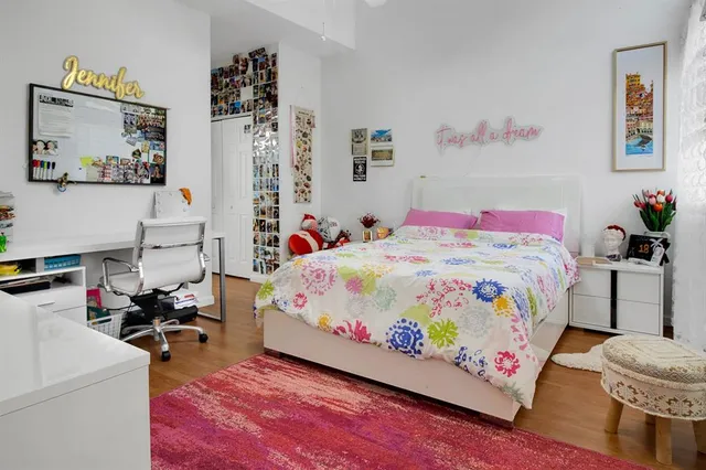 a bedroom with bed and furniture