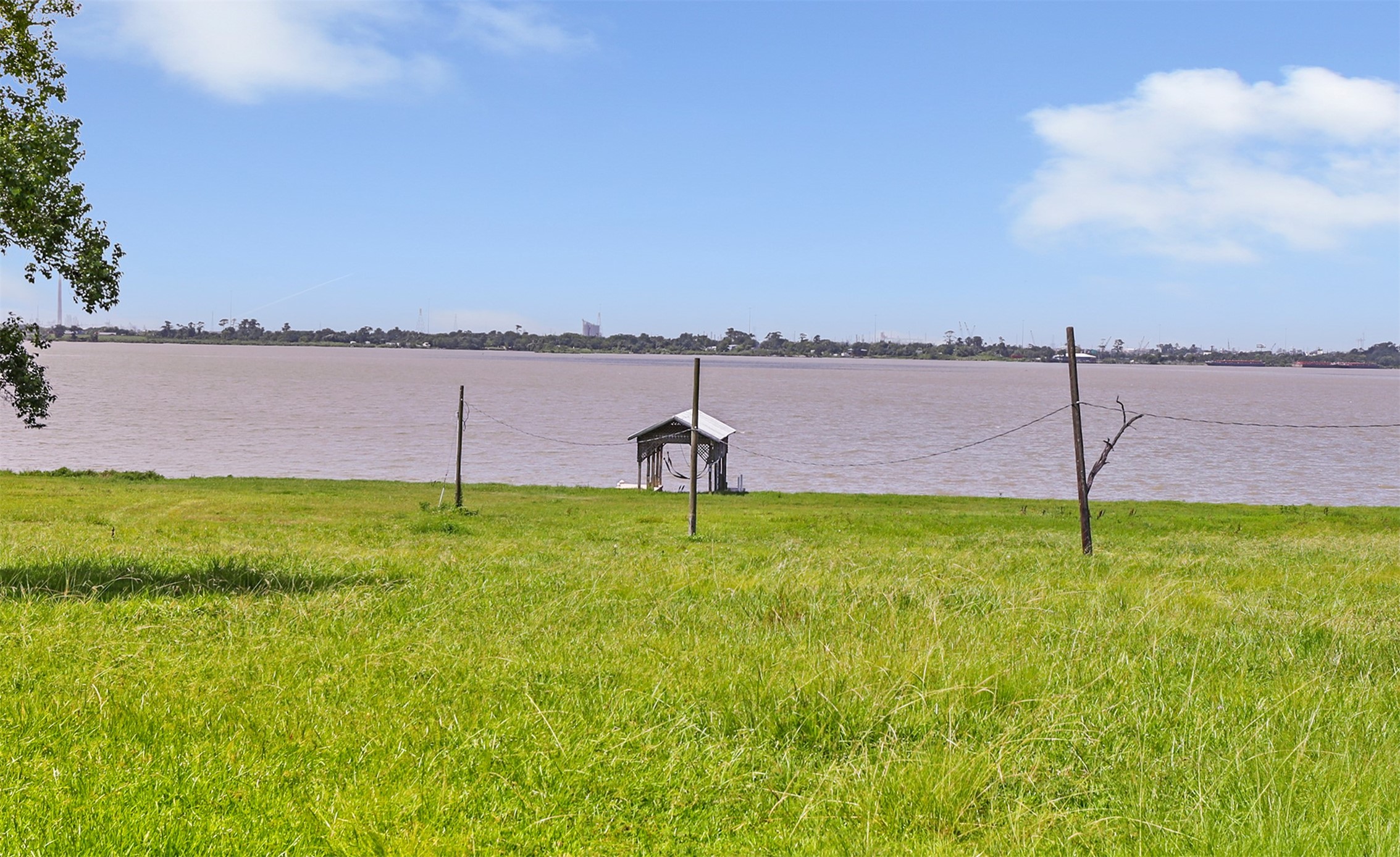 111 South 8th Street Highlands, TX 77562 - Photo 11 of 50 a swimming pool with yard and lake view