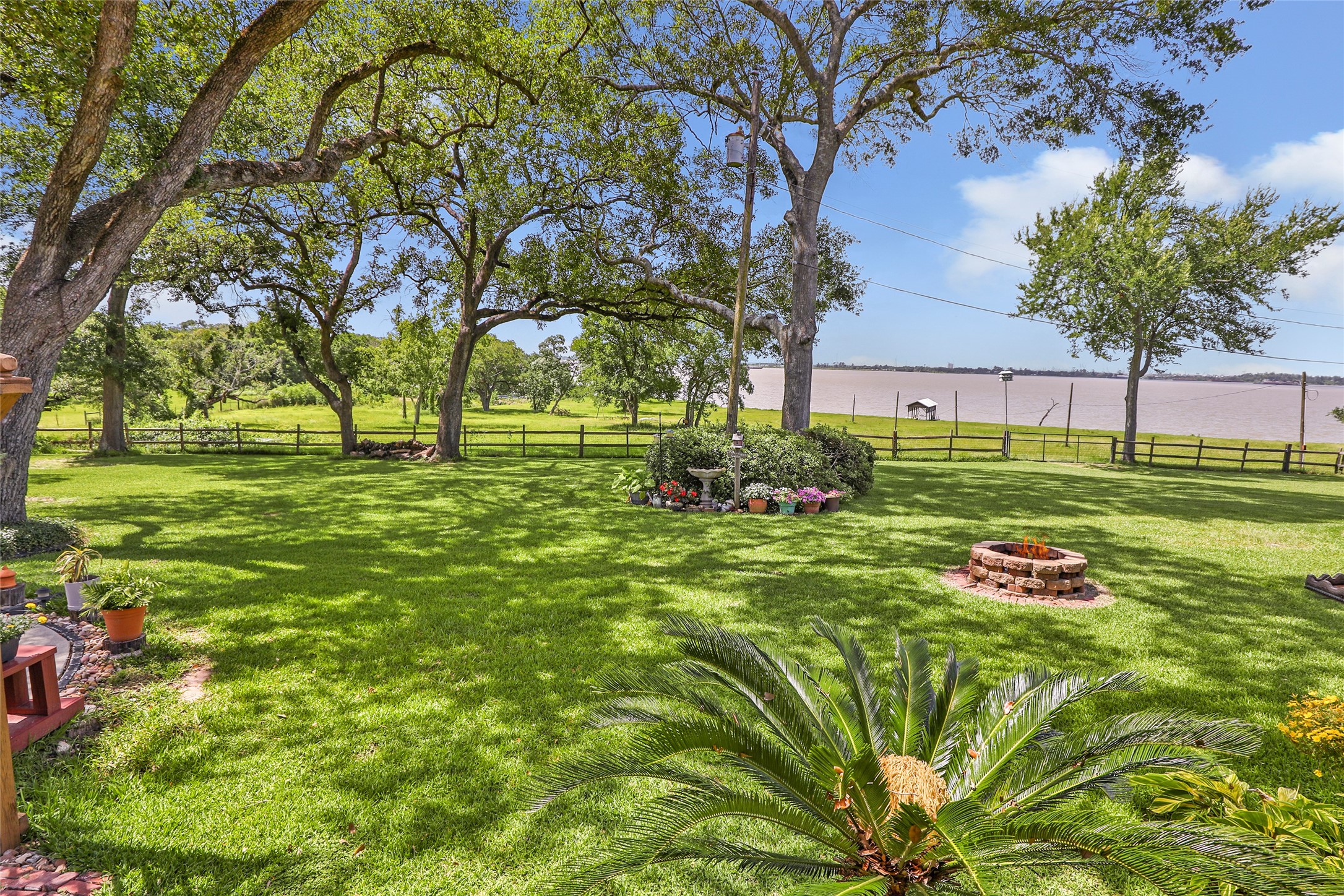 111 South 8th Street Highlands, TX 77562 - Photo 18 of 50 a green field with lots of trees