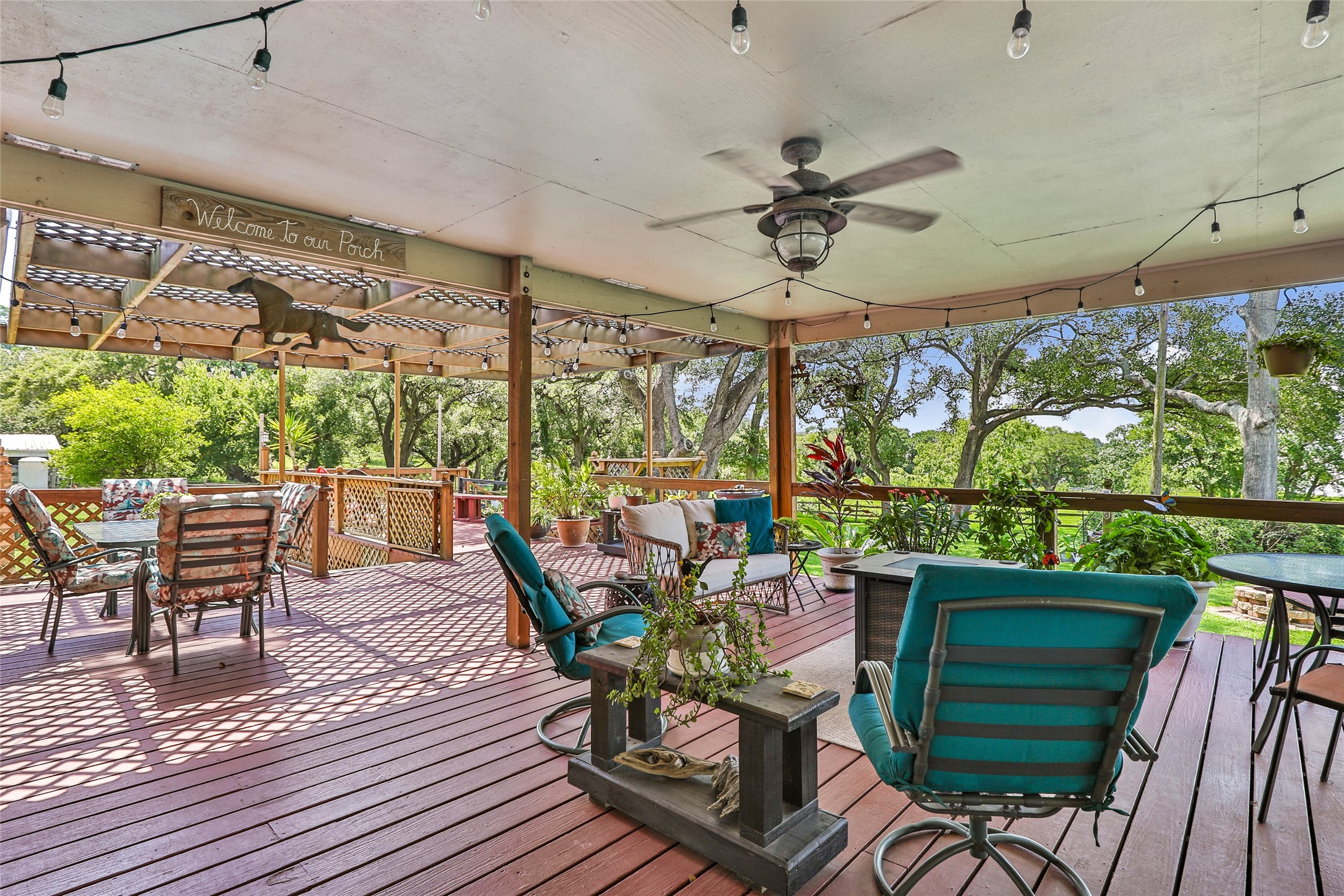 111 South 8th Street Highlands, TX 77562 - Photo 19 of 50 a view of a patio with a dining table and chairs