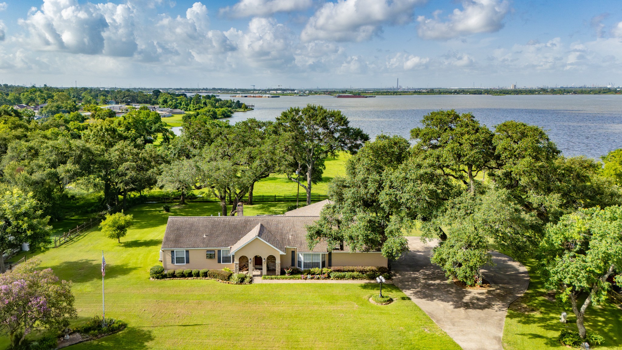 111 South 8th Street Highlands, TX 77562 - Photo 2 of 50 a view of a swimming pool with lawn chairs next to yard