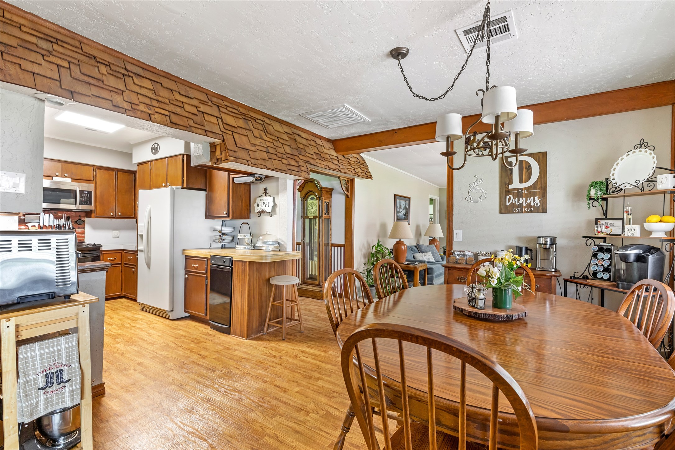 111 South 8th Street Highlands, TX 77562 - Photo 25 of 50 a very nice looking dining room with kitchen island stainless steel appliances a dining table and chairs