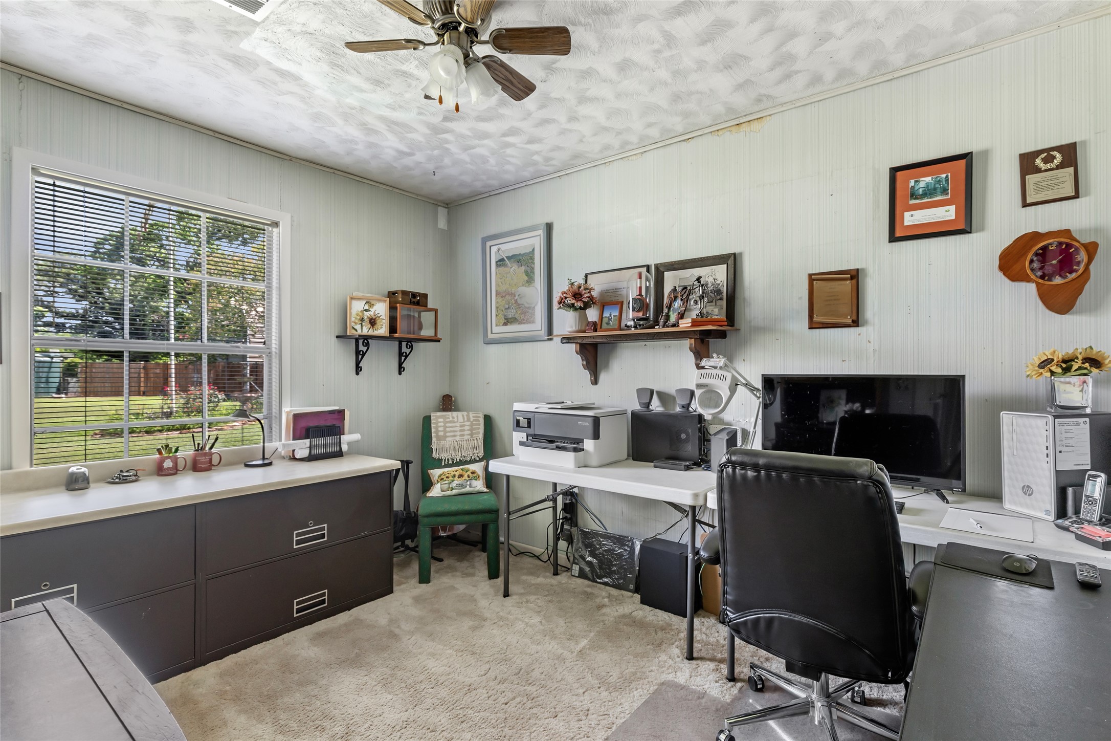 111 South 8th Street Highlands, TX 77562 - Photo 34 of 50 a view of a workspace with furniture and a window
