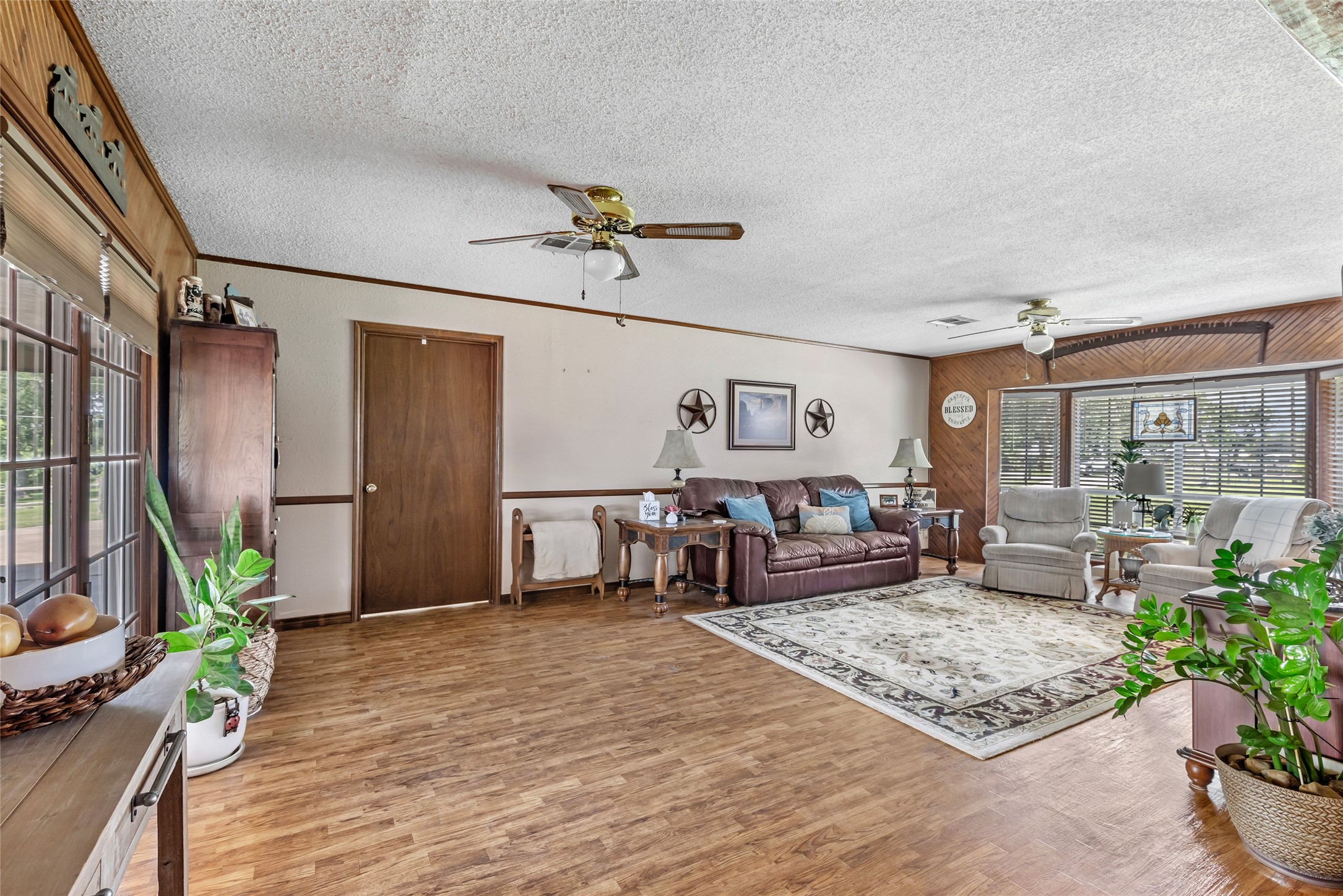 111 South 8th Street Highlands, TX 77562 - Photo 37 of 50 a living room with furniture ceiling fan and a rug