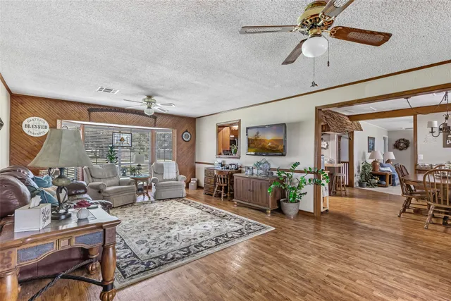a living room with furniture and a rug