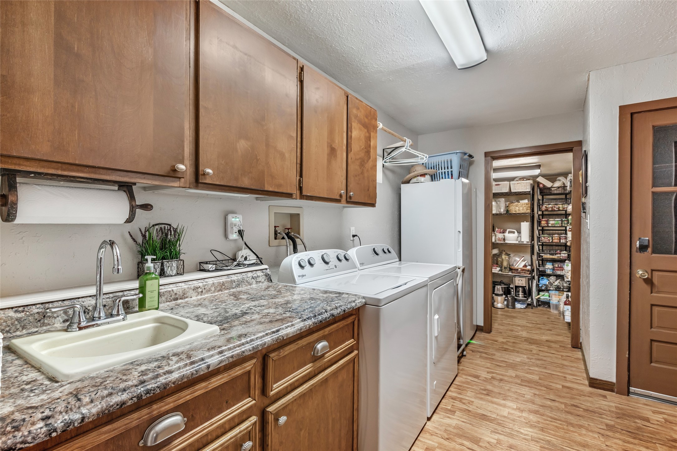 111 South 8th Street Highlands, TX 77562 - Photo 41 of 50 a kitchen with a sink and cabinets