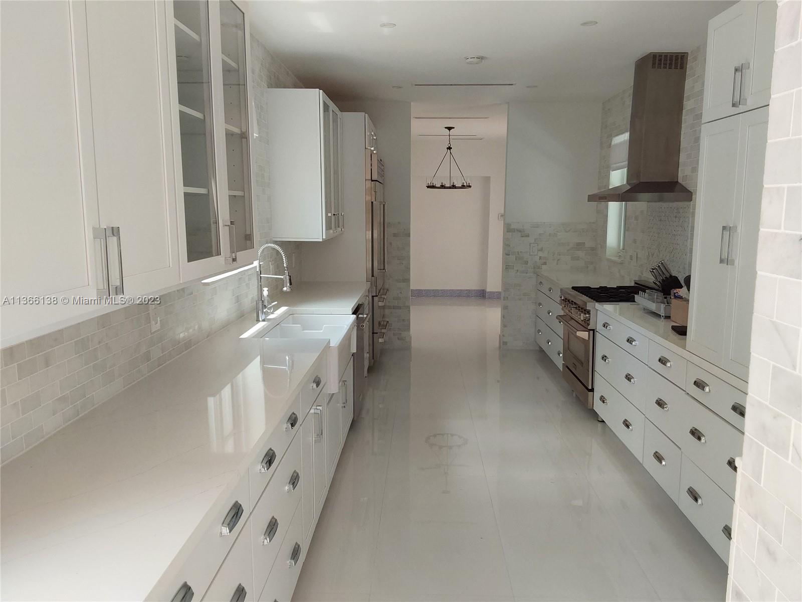 La Gorce Miami Beach, FL 33140 - Photo 12 of 33 a spacious bathroom with double vanity and mirrors