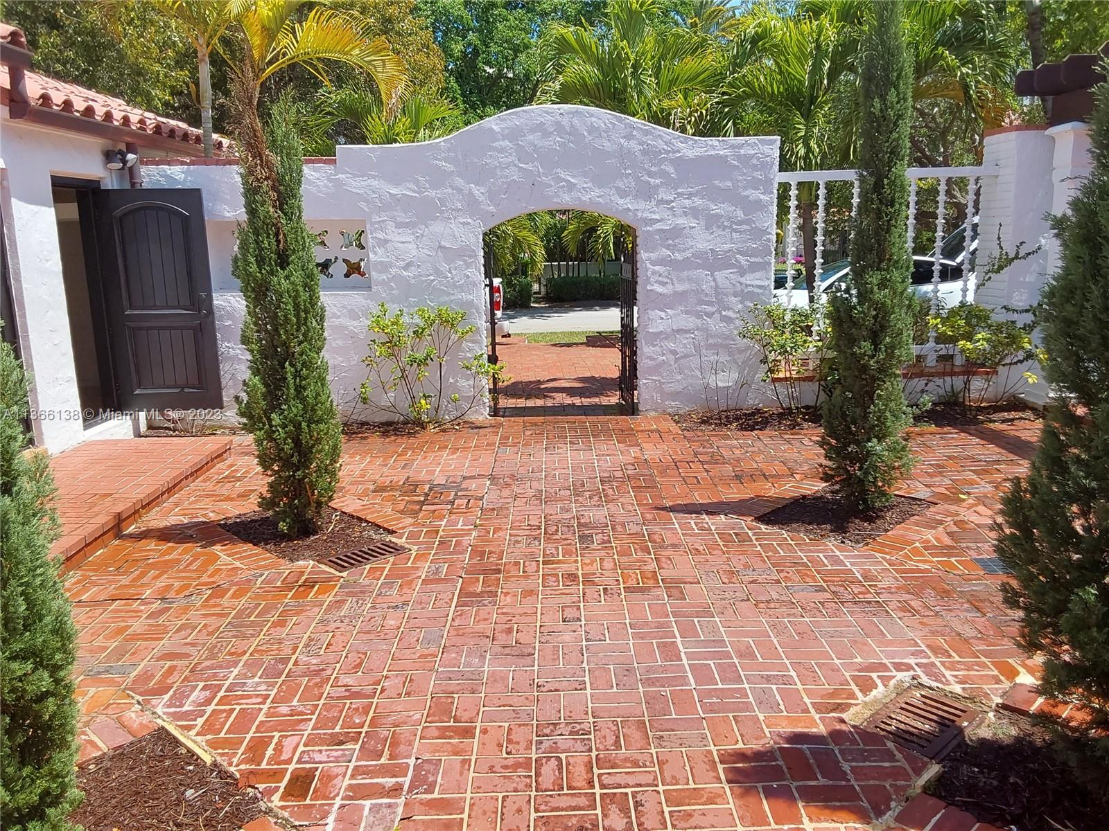 La Gorce Miami Beach, FL 33140 - Photo 15 of 33 a front view of a house with garden