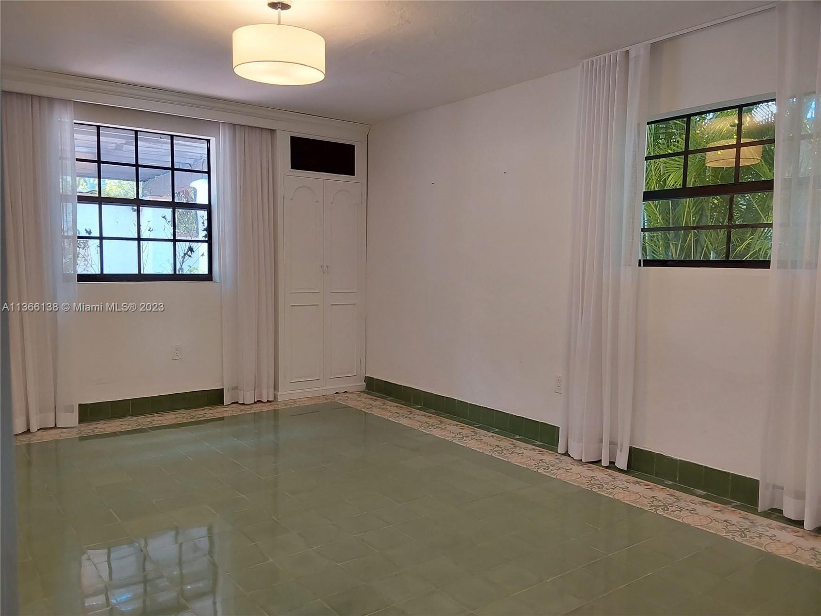 La Gorce Miami Beach, FL 33140 - Photo 20 of 33 an empty room with windows