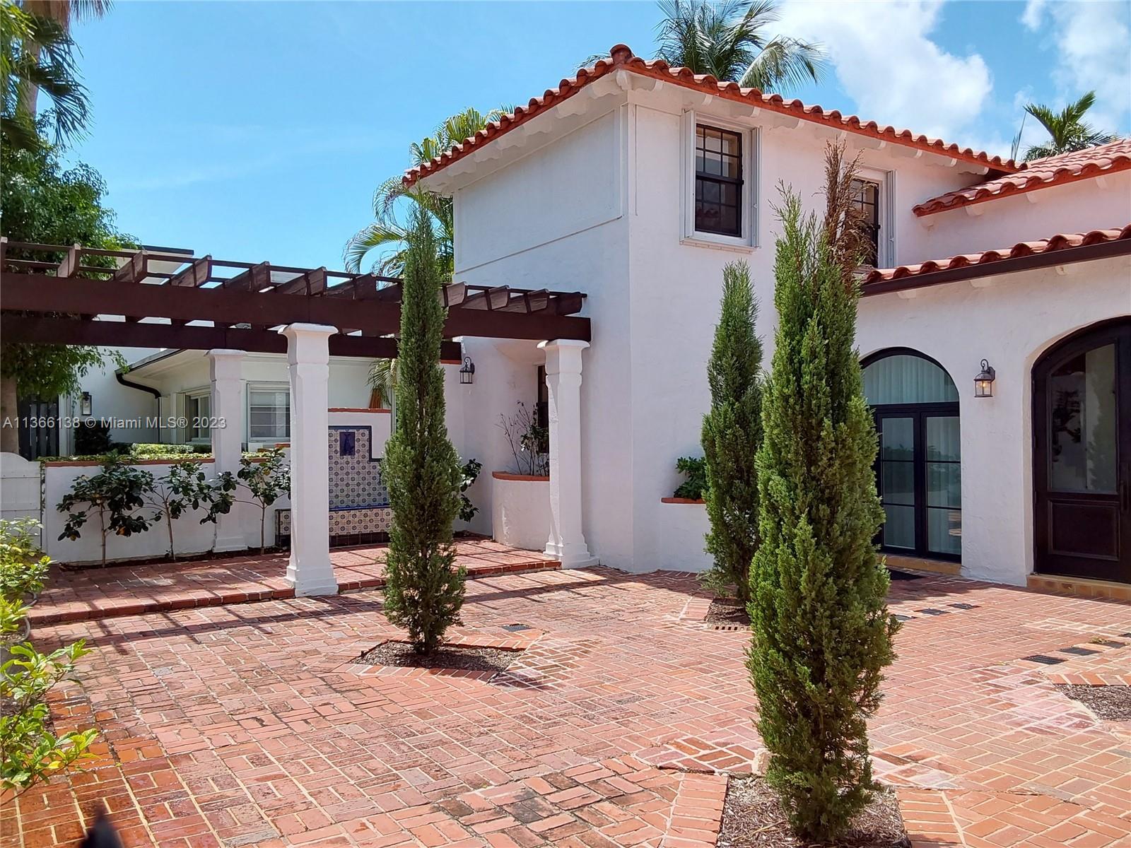 La Gorce Miami Beach, FL 33140 - Photo 2 of 33 a view of a house with yard and potted plants