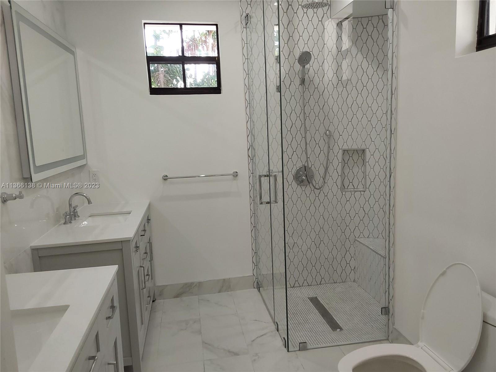 La Gorce Miami Beach, FL 33140 - Photo 23 of 33 a bathroom with a sink toilet and shower