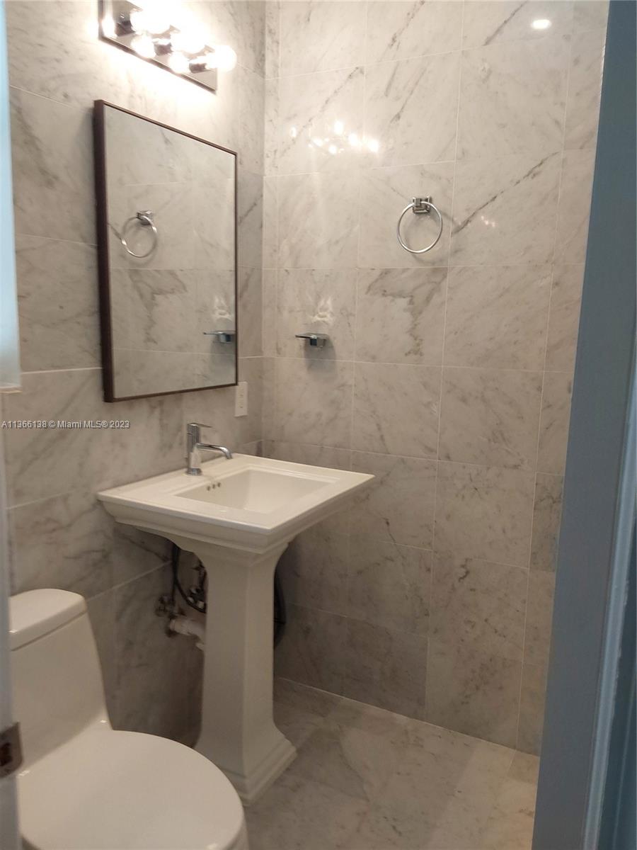 La Gorce Miami Beach, FL 33140 - Photo 28 of 33 a bathroom with a sink toilet and mirror