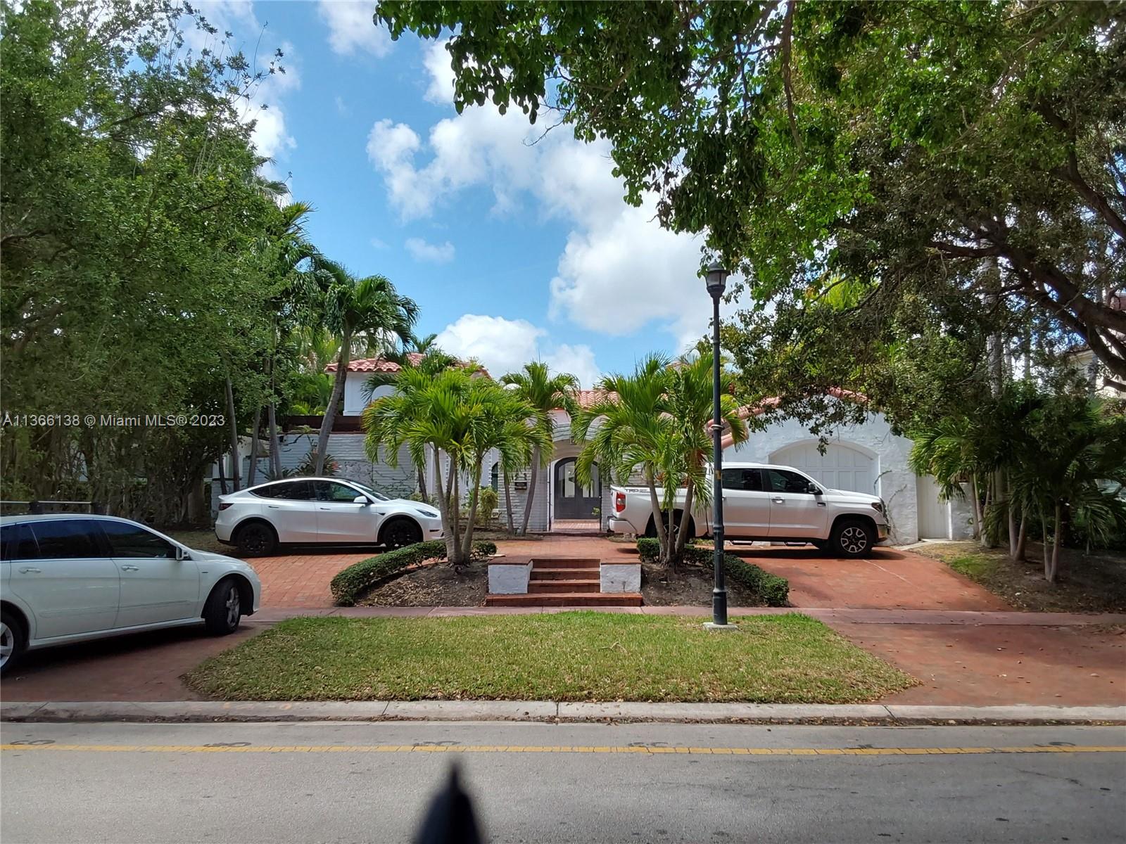 La Gorce Miami Beach, FL 33140 - Photo 30 of 33 a group of cars parked in front of a house