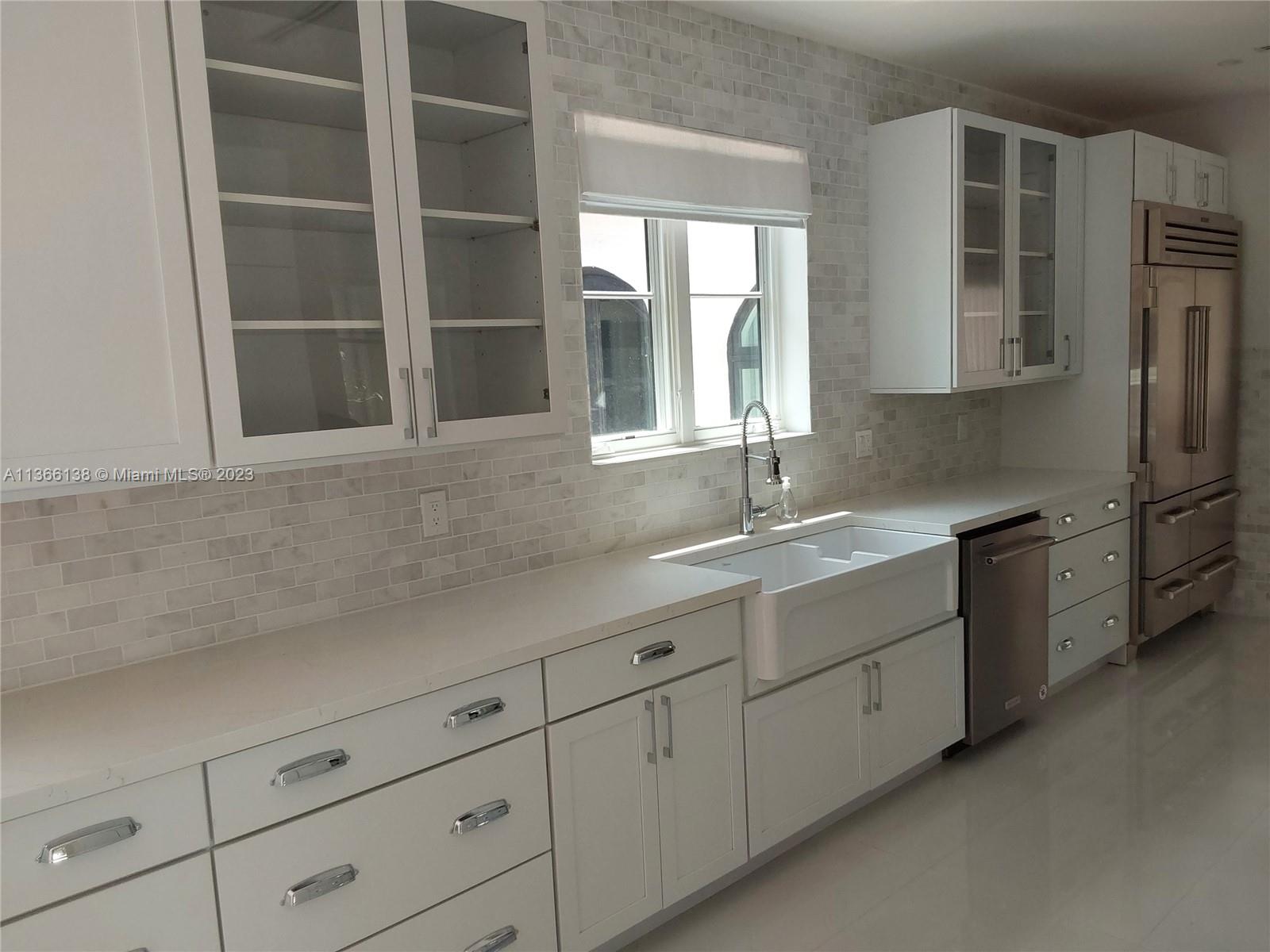 La Gorce Miami Beach, FL 33140 - Photo 32 of 33 a sink with cabinets and window